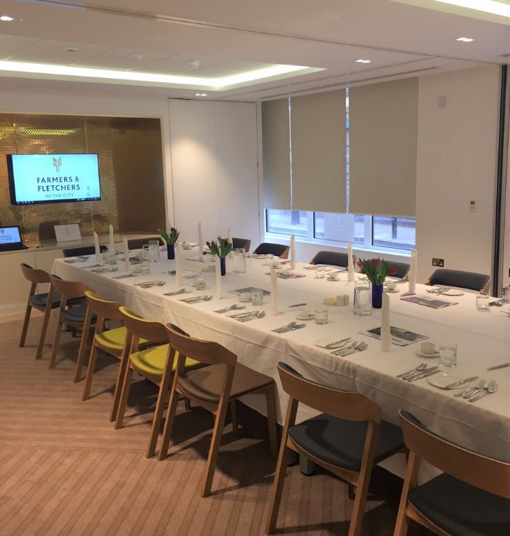 Elegant meeting room with long table, perfect for corporate events and presentations.