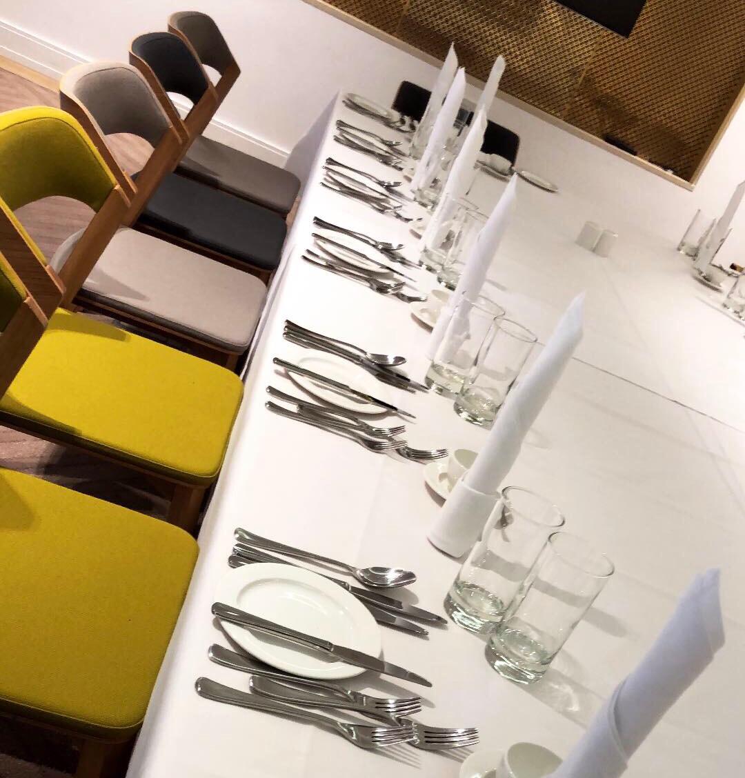 Elegant dining table setup in The Court Room for formal events and meetings.