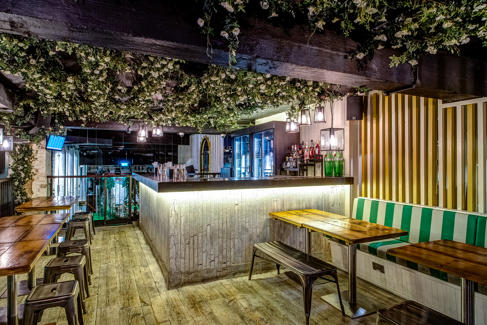 Stylish Gin Terrace with rustic tables, perfect for cocktail receptions and networking events.