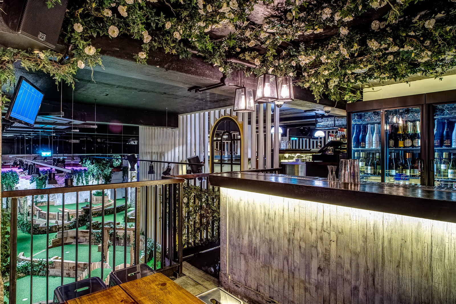 Upperclub House & Gin Terrace: stylish venue with floral decor for events and gatherings.