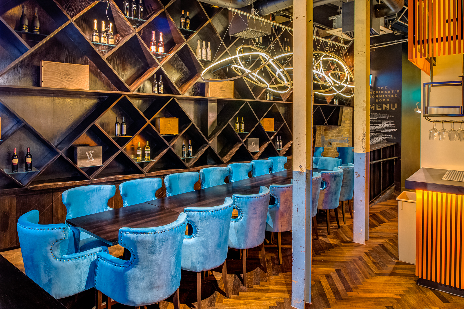 Elegant meeting room with plush blue chairs, perfect for corporate events and gatherings.