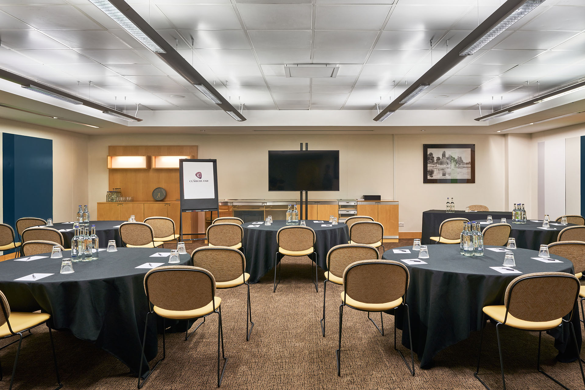 Meeting room at The Cumberland Hotel with dark linens, ideal for corporate events.
