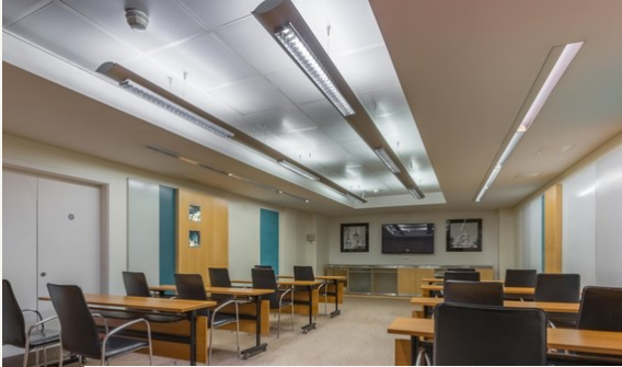 Modern meeting room at The Cumberland Hotel, featuring ergonomic chairs and tech setup.