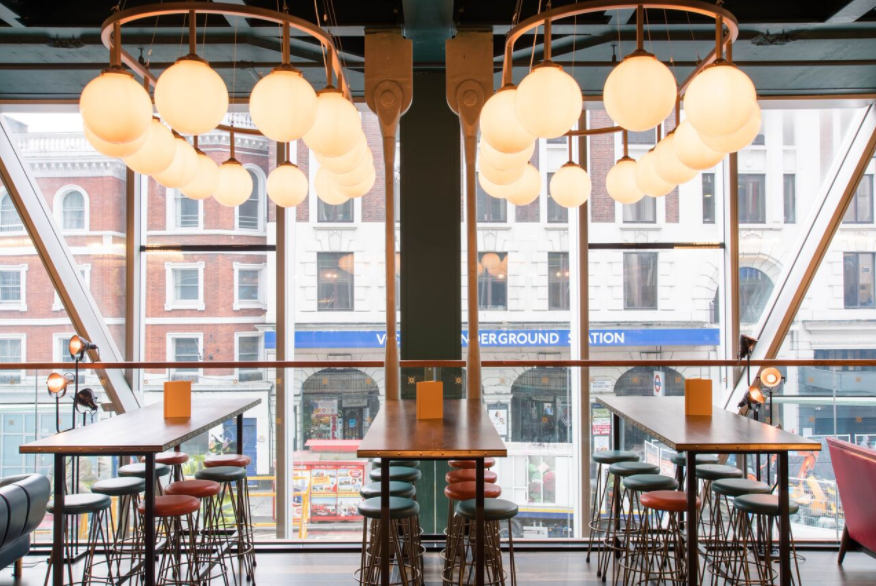 Modern Sports Lounge in Greenwood with stylish lighting, ideal for networking events.