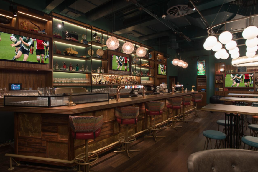 Stylish Sports Lounge bar in Greenwood with sleek counter, ideal for networking events.