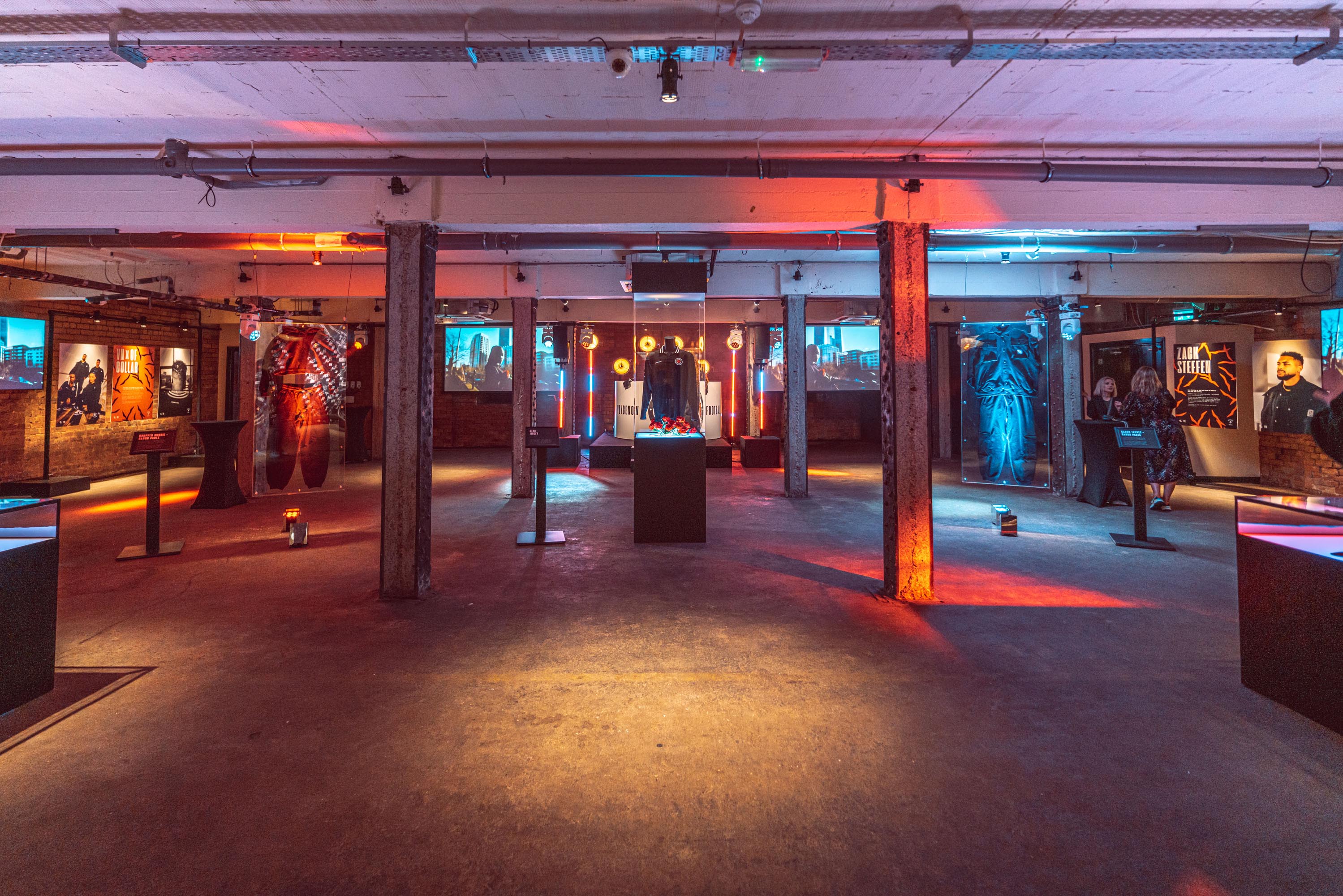 Versatile event space at Victoria Warehouse with dynamic lighting for exhibitions and networking.
