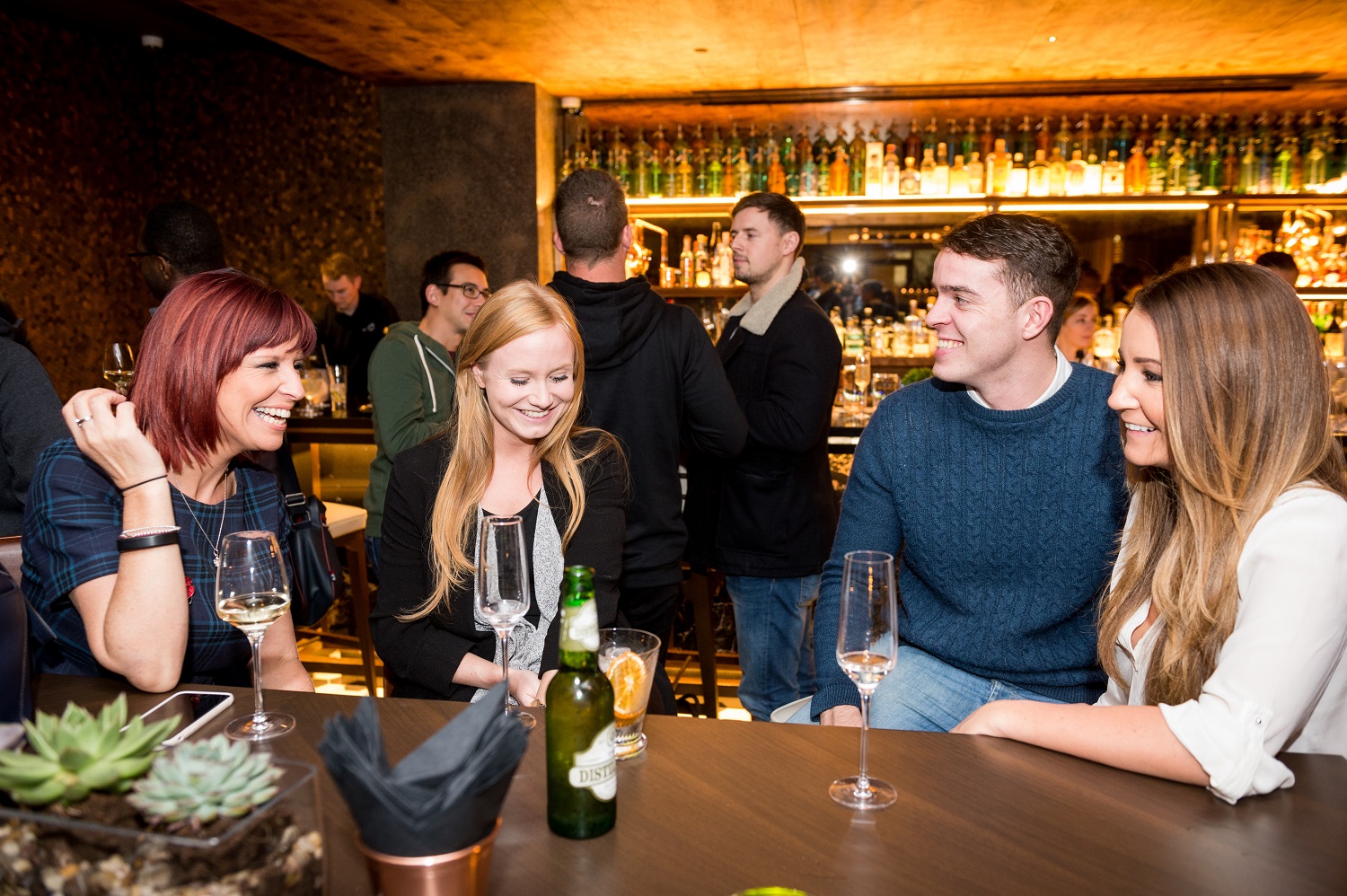 Vibrant networking event at Hilton London Bankside bar with stylish seating and ambiance.