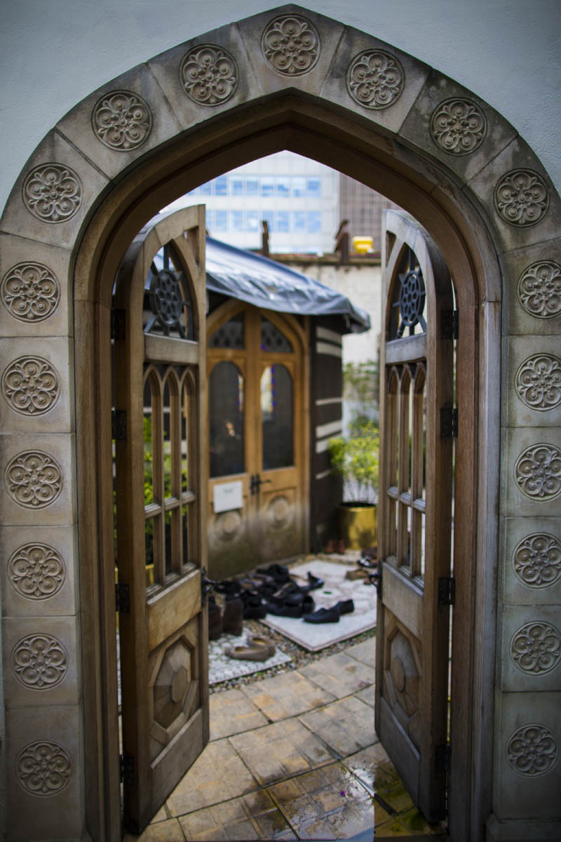 Ornate arched doors at The Tent, ideal for intimate gatherings and creative meetings.