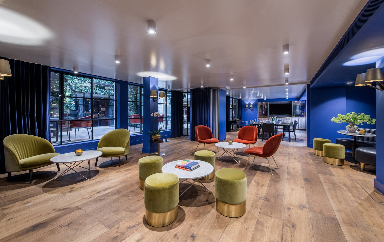 Modern Blue Room meeting space with vibrant decor, ideal for networking events.