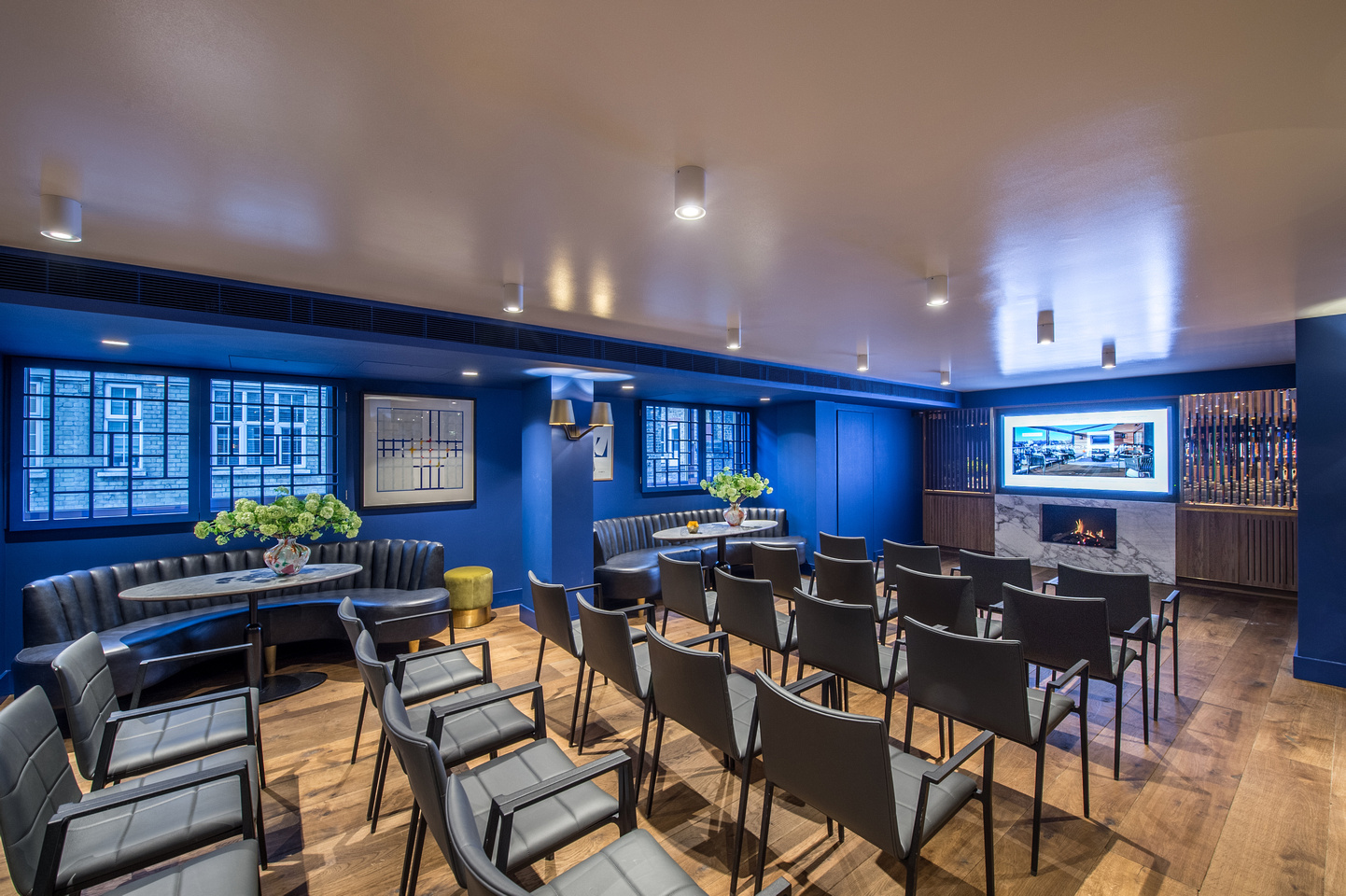 Modern Blue Room meeting space in The Marylebone, ideal for presentations and gatherings.