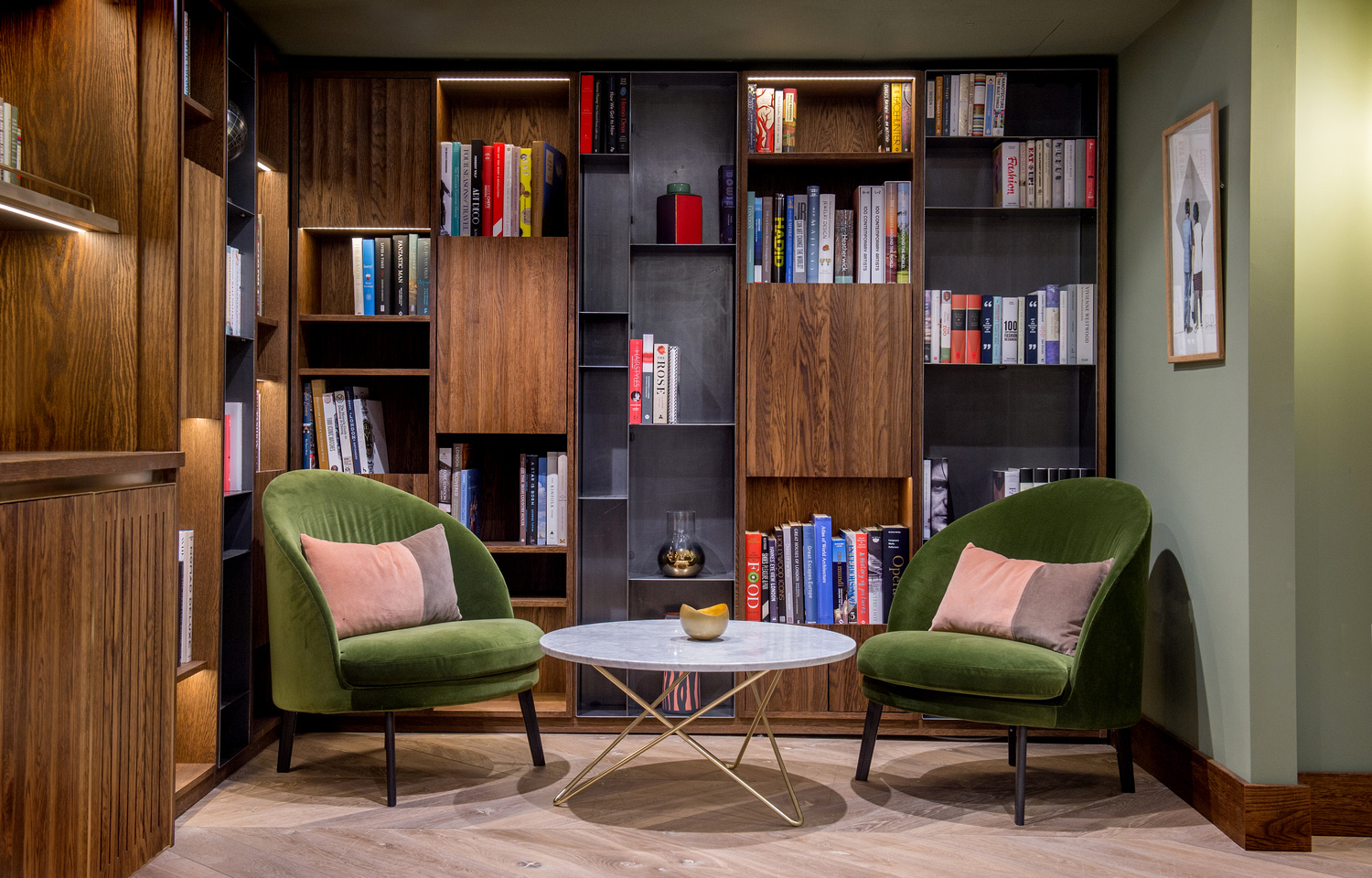 Stylish meeting space with green chairs in The Library, perfect for brainstorming sessions.
