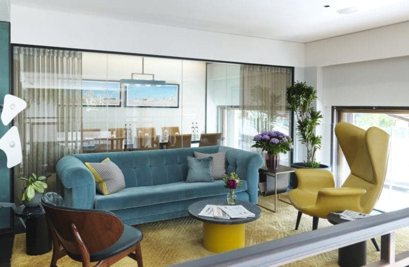 Private dining room with modern decor, ideal for meetings and events at The Athenaeum Hotel.