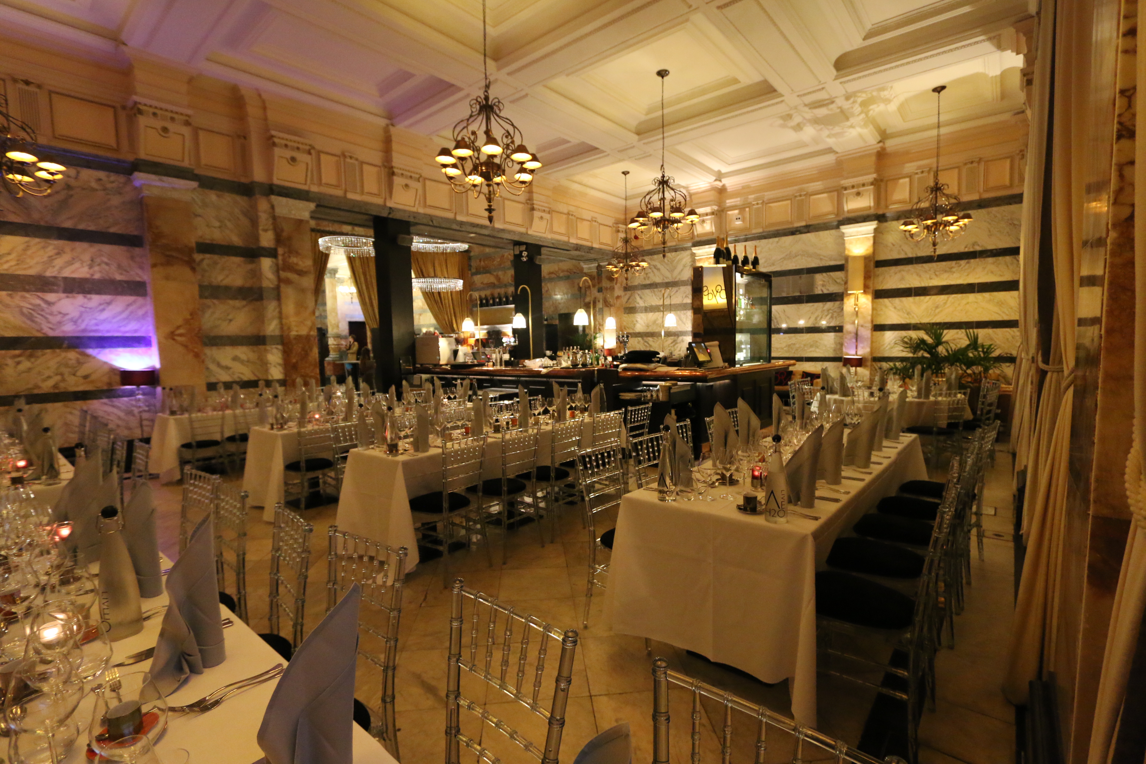 Elegant event space at Boyds Grill & Wine Bar with chandeliers for corporate gatherings.