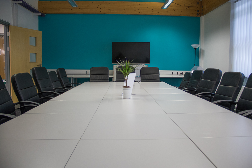 Modern conference room with ergonomic chairs for productive meetings and presentations.