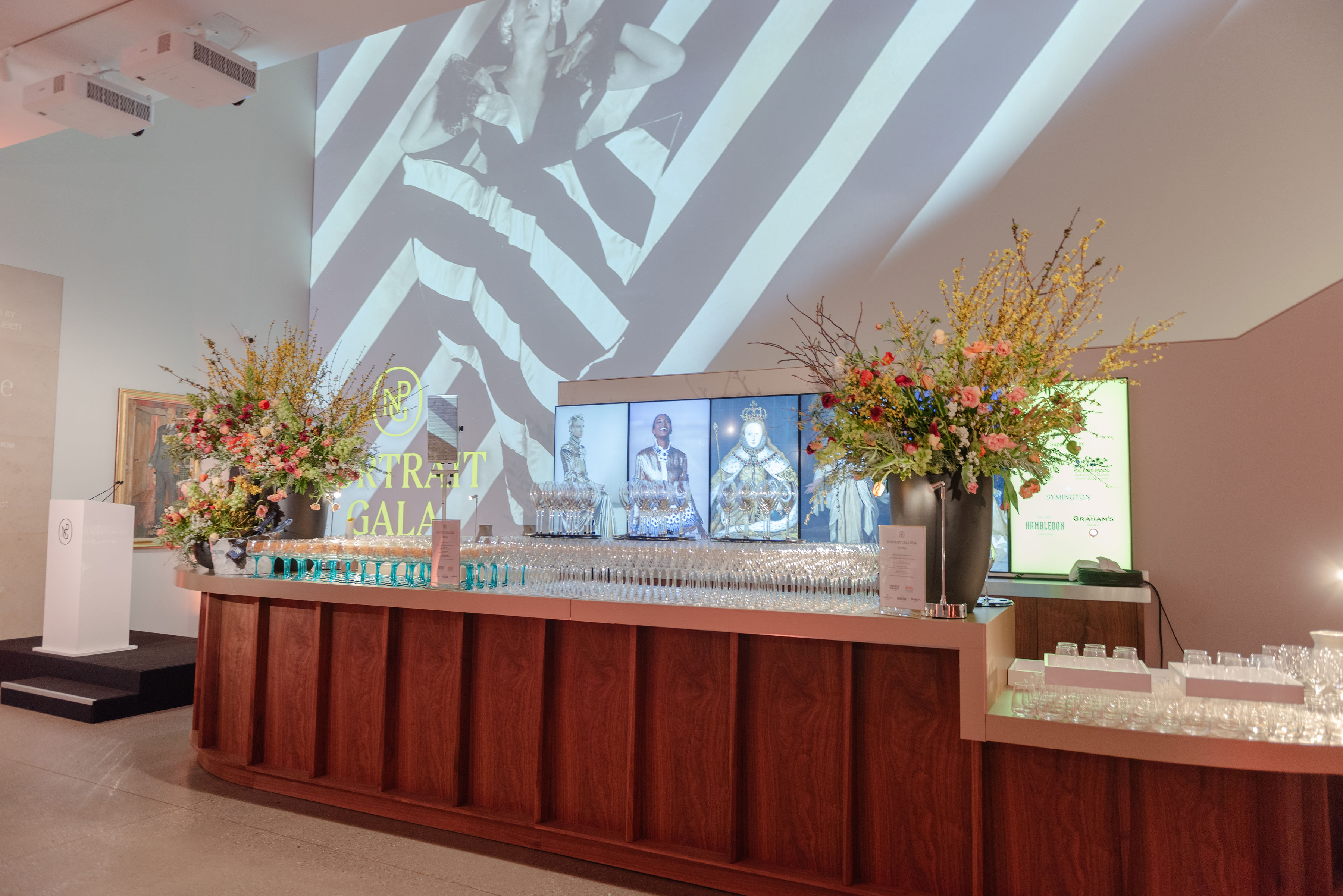 Ondaatje Main Hall with elegant bar and floral decor for upscale galas and events.