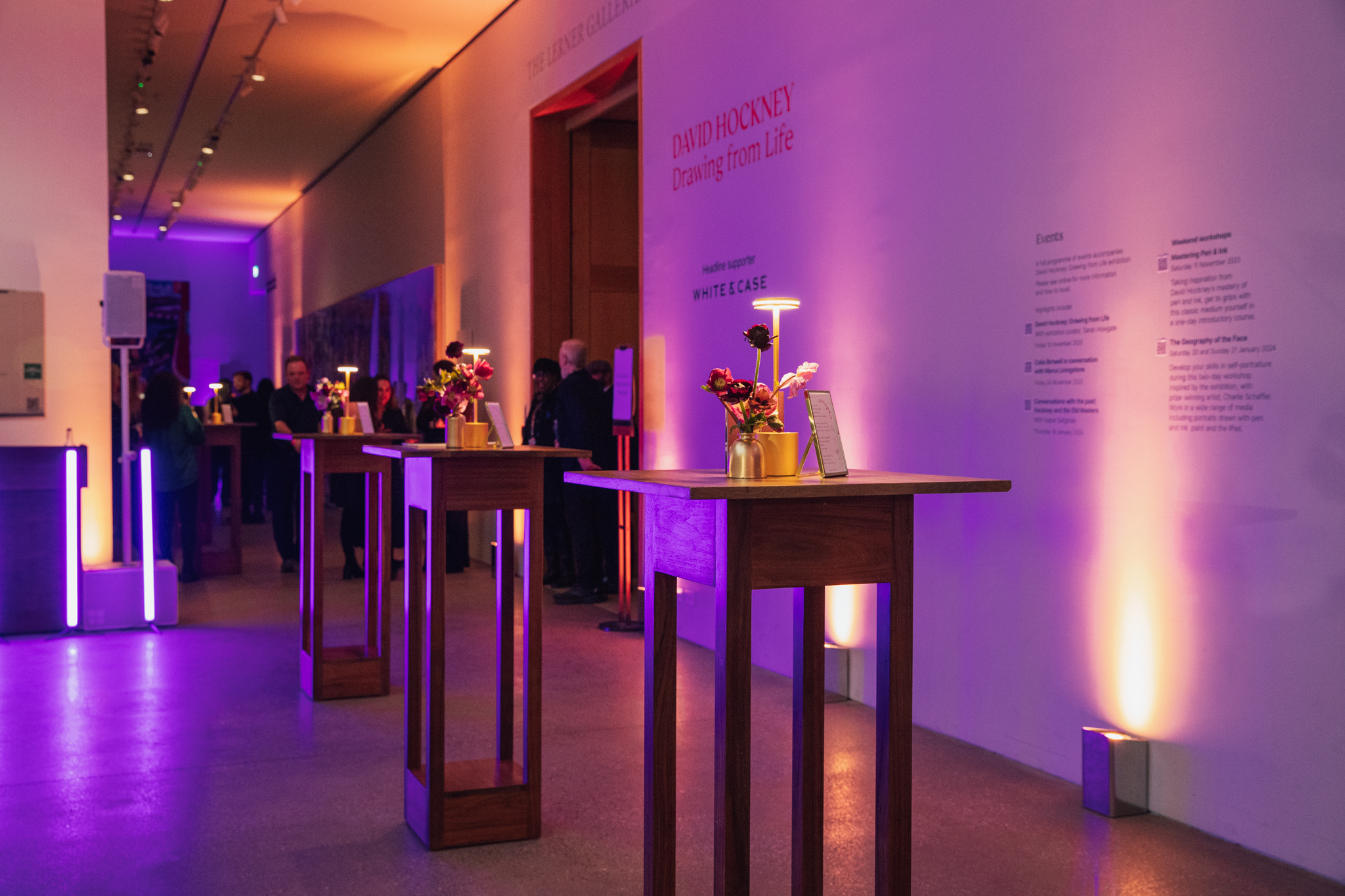 Stylish Ondaatje Main Hall with floral centerpieces, ideal for receptions and cocktail events.