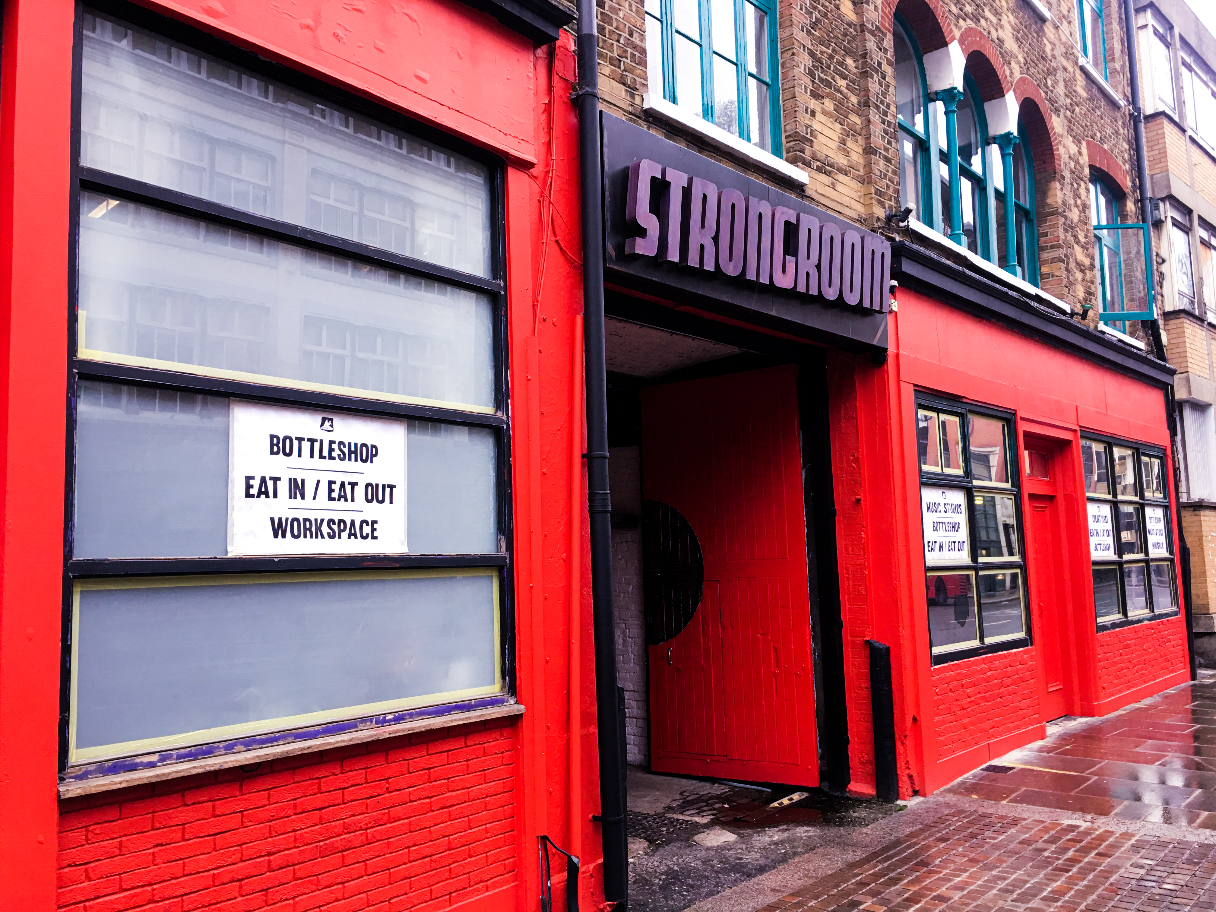 Vibrant venue entrance at Strongroom Bar & Kitchen for casual meetings and events.