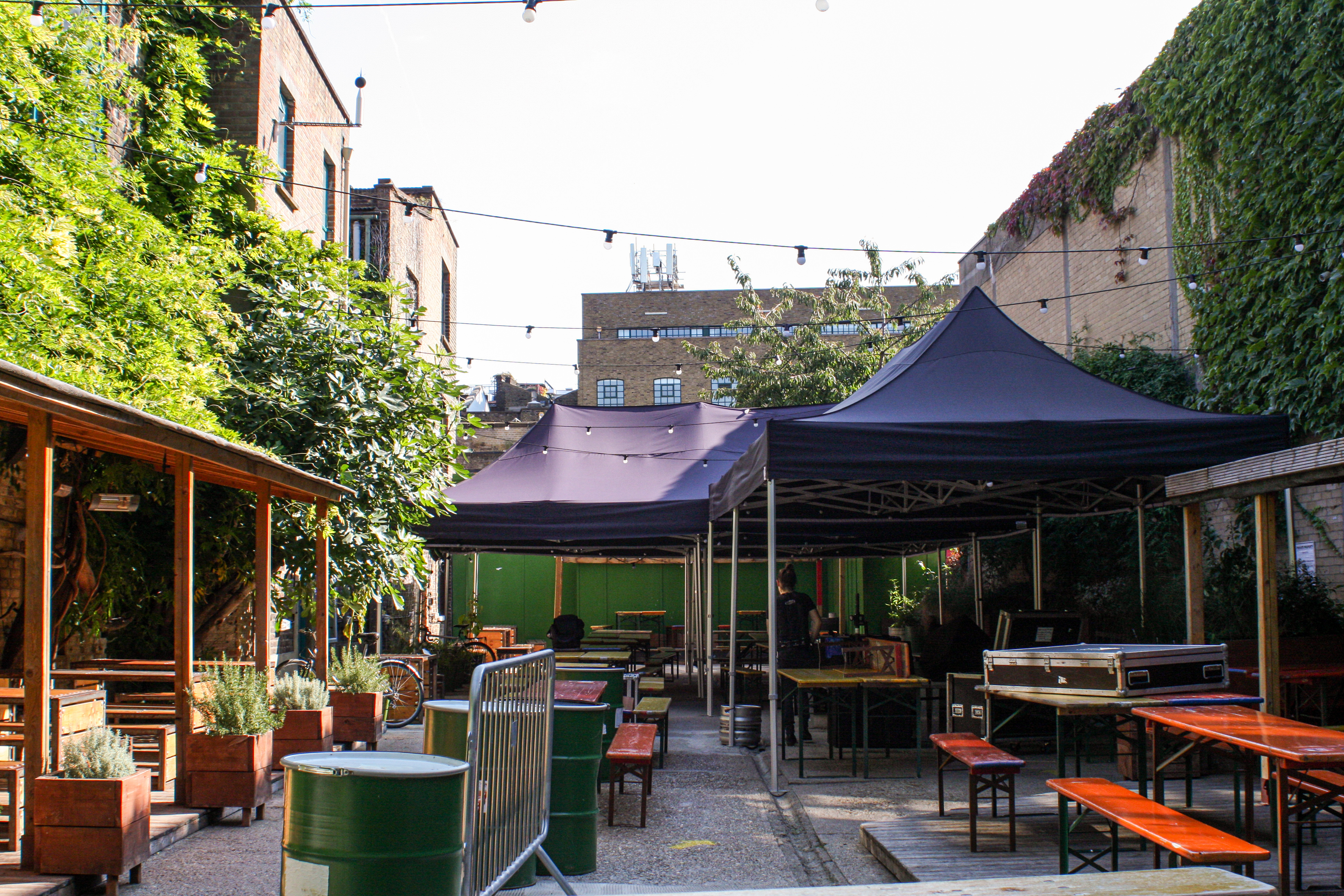 Versatile outdoor event space at Strongroom Bar & Kitchen with tents and greenery.