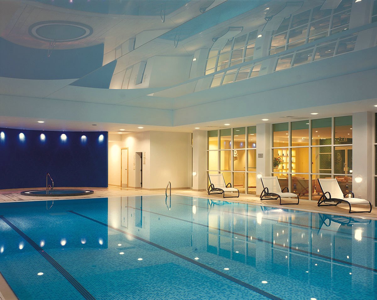 Modern indoor pool at Regency Park Hotel, ideal for upscale events and wellness retreats.