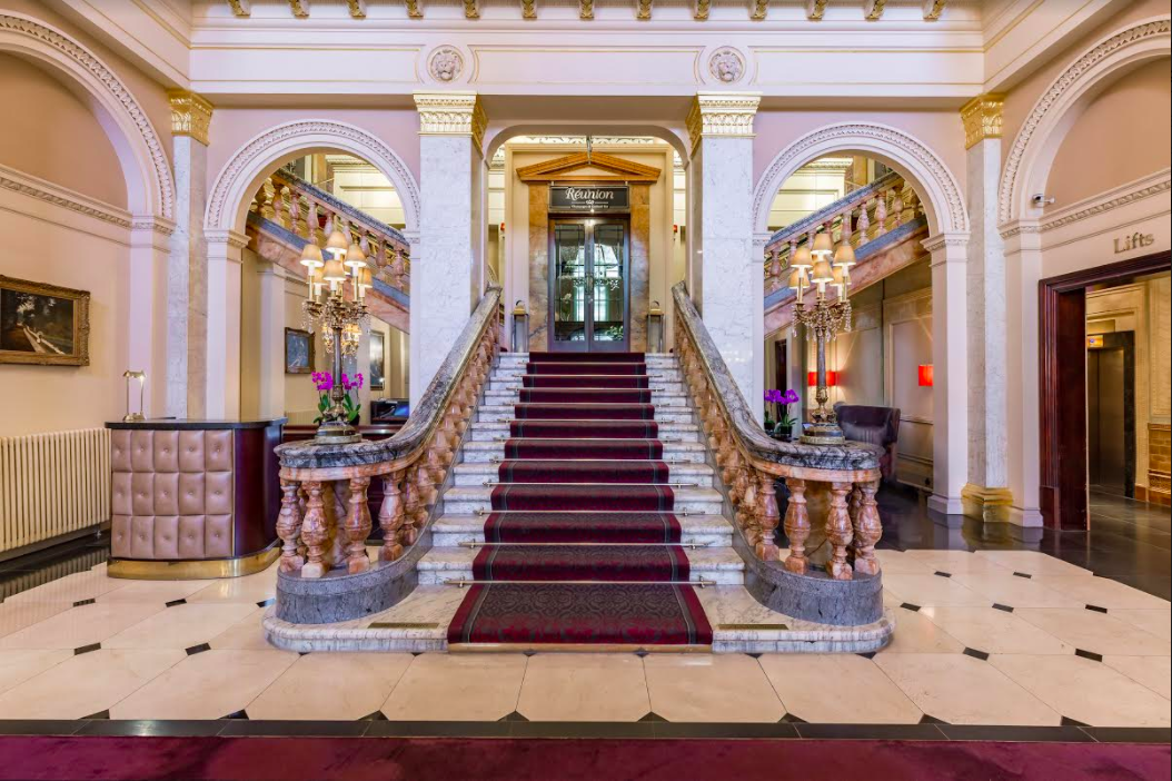 Elegant Viceroy Room lobby with grand staircase, ideal for events and meetings.
