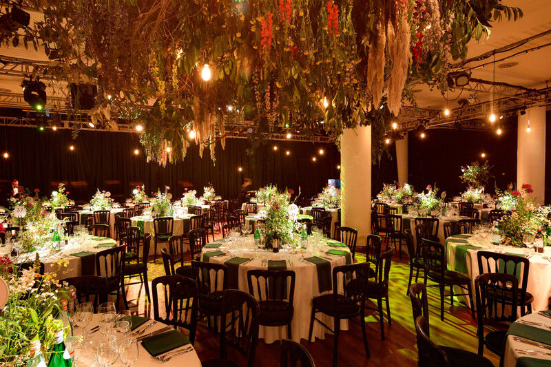 Royal Festival Hall Auditorium with elegant tables and floral centerpieces for upscale events.