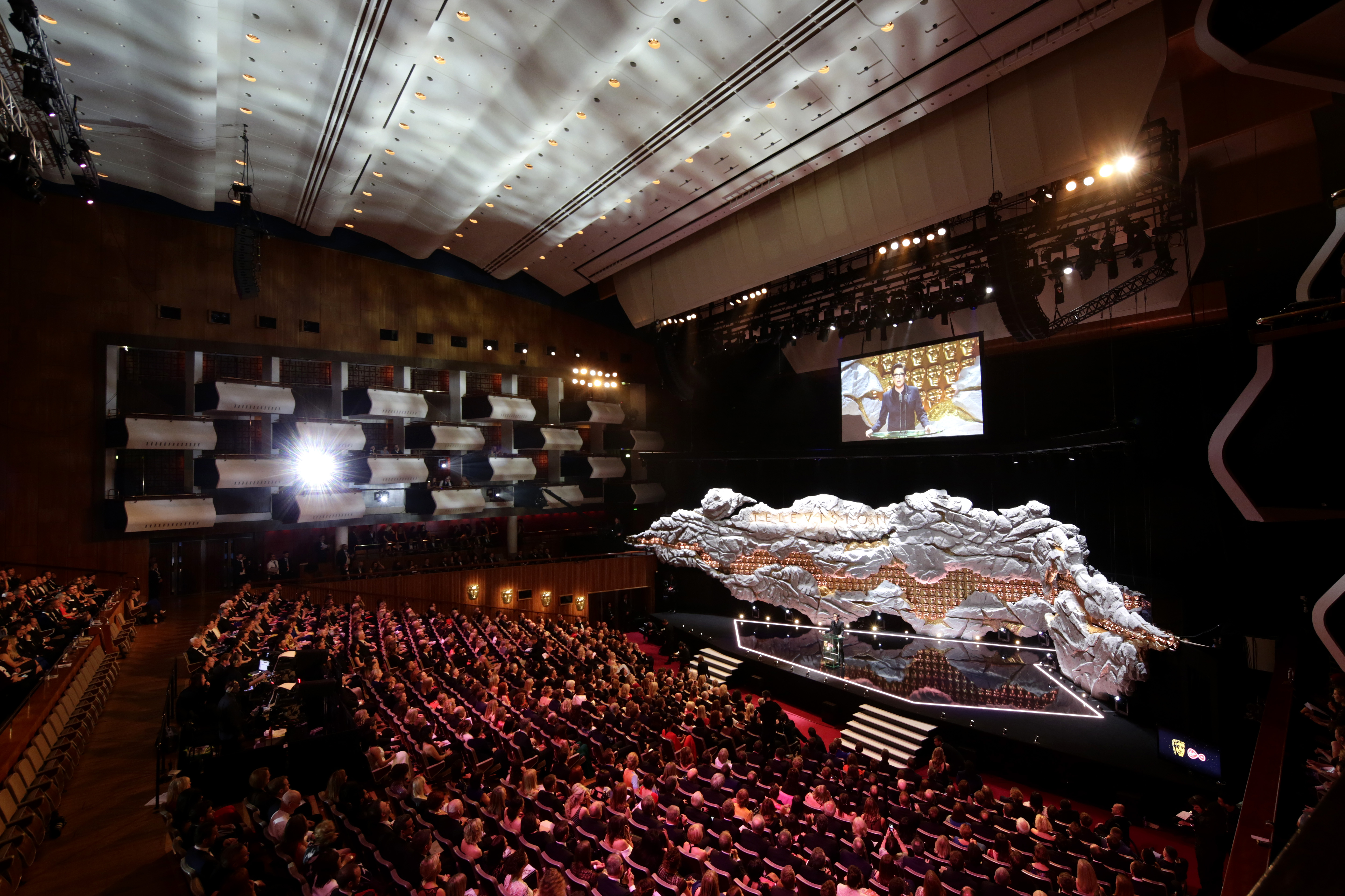 Royal Festival Hall Auditorium with vibrant stage design for conferences and performances.