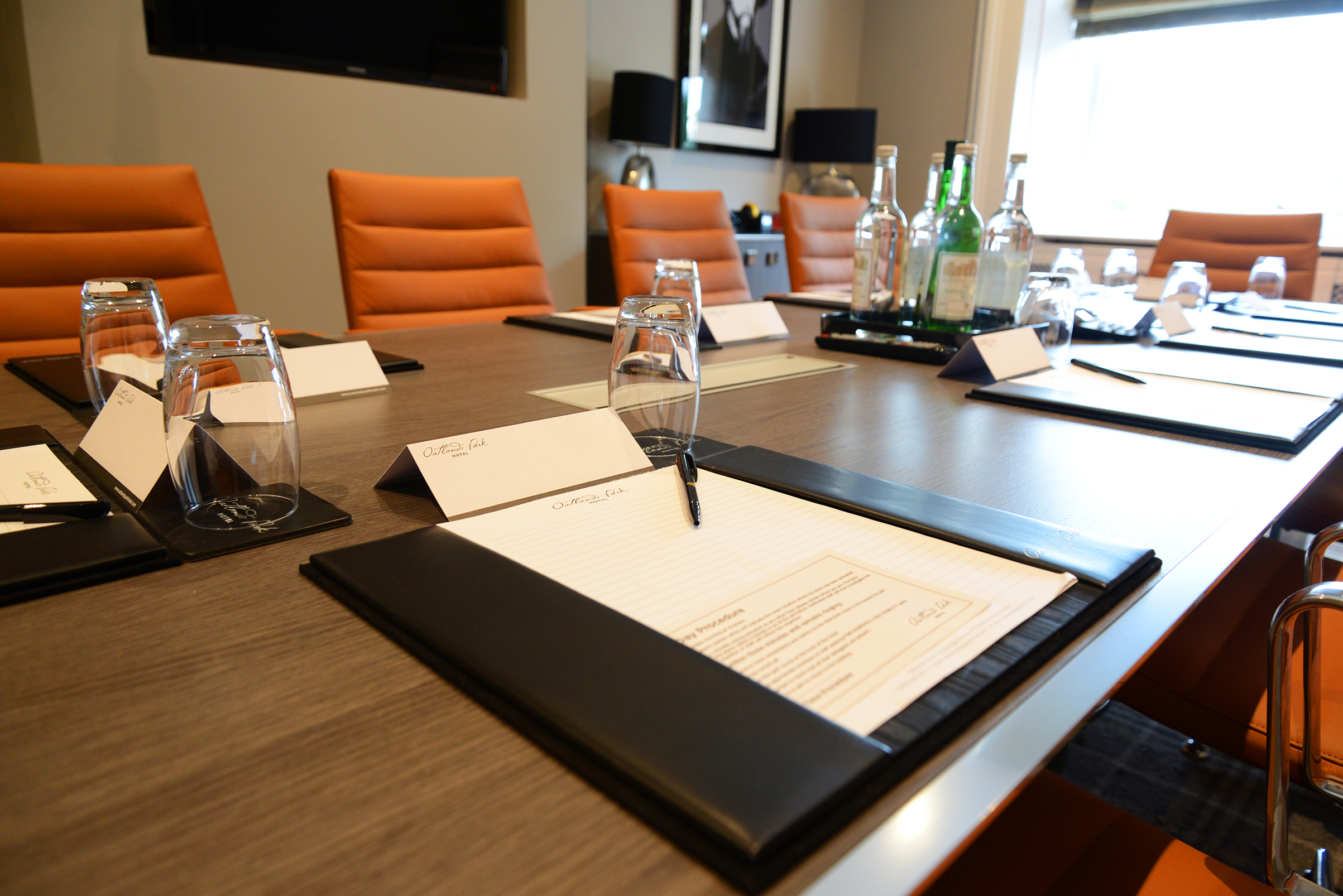 Howard Room at Oatlands Park Hotel, polished table set for a professional conference meeting.