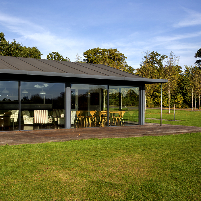 Modern glass-fronted lodge in Emsworth Polo Grounds, ideal for events and meetings.