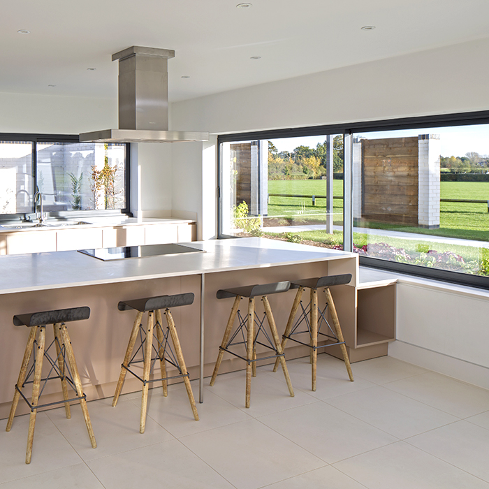Modern kitchen with island seating at Emsworth Polo Grounds, ideal for workshops and gatherings.