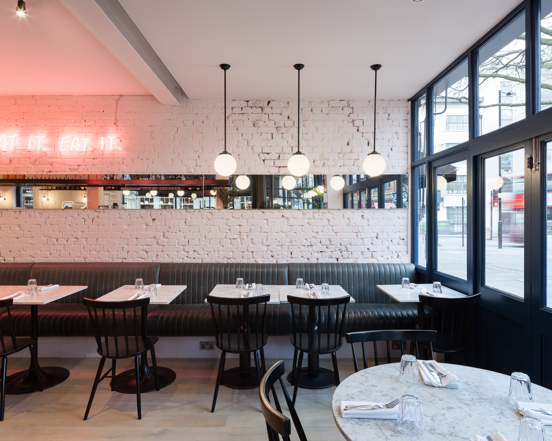Modern dining venue in Exmouth Market with cozy booths, ideal for events and gatherings.