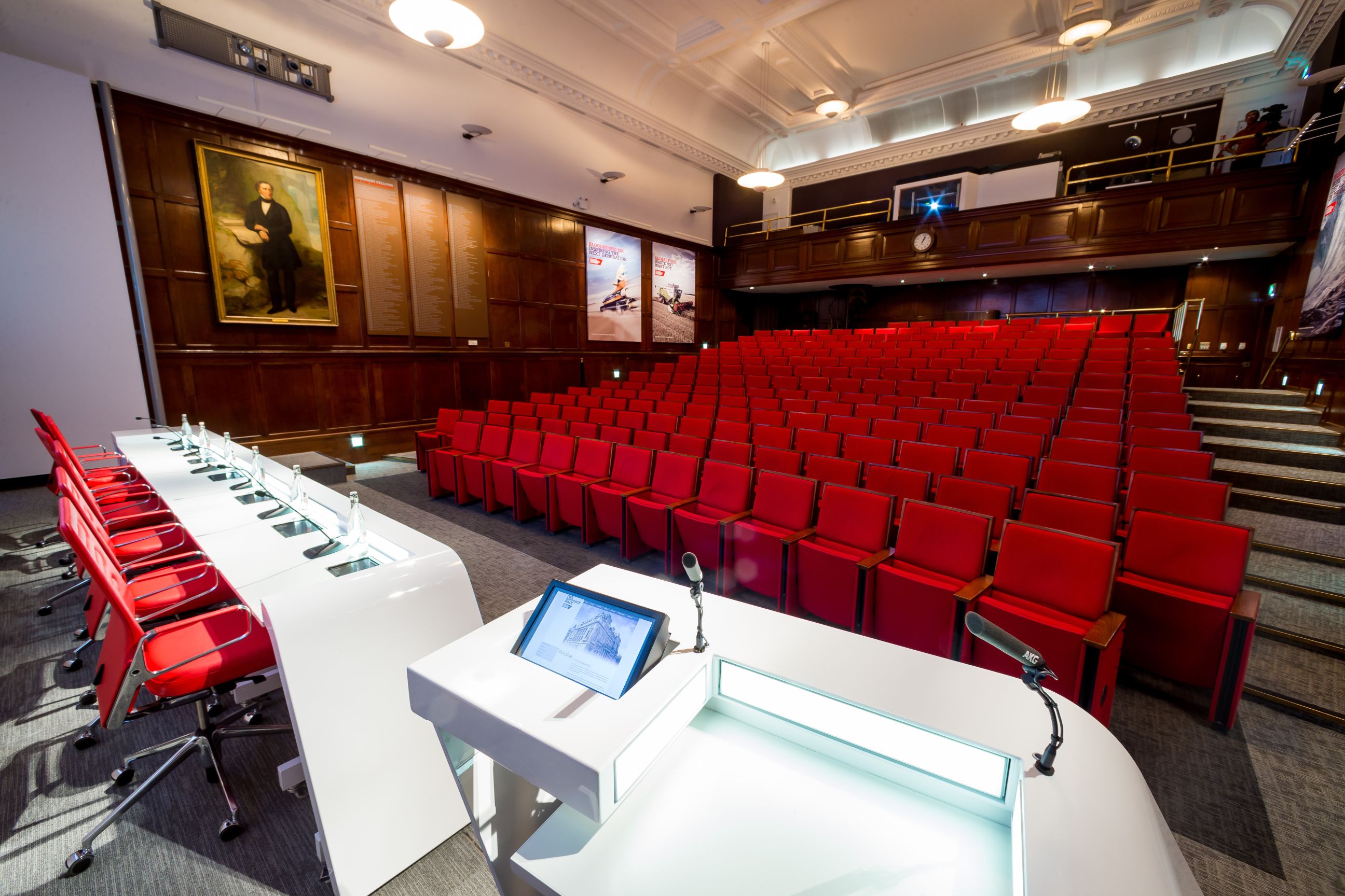 Lecture Theatre at One Birdcage Walk with red chairs, ideal for conferences and presentations.