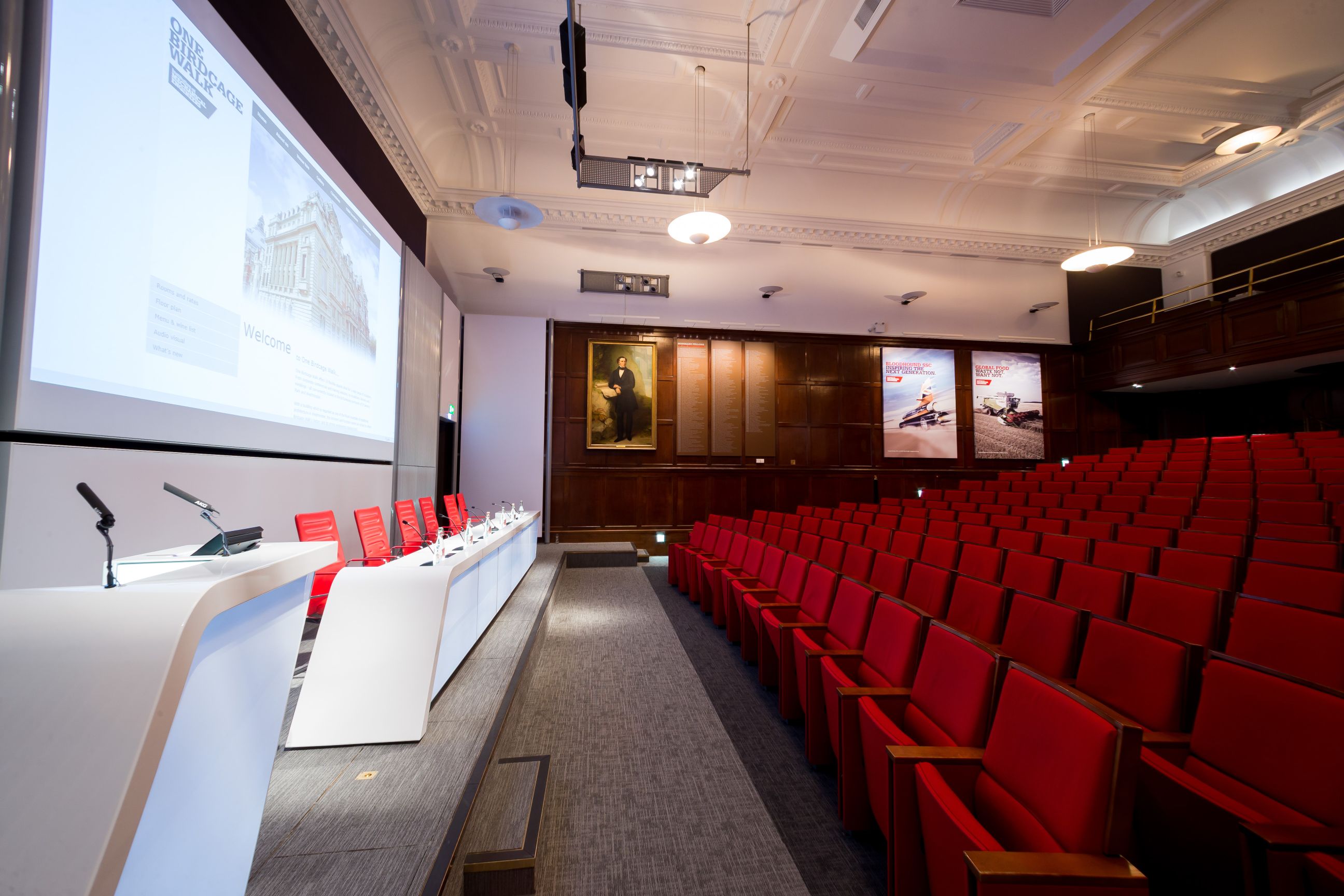 Lecture Theatre at One Birdcage Walk with modern stage, ideal for conferences and presentations.