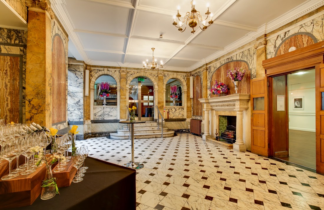 Elegant Marble Hall with chandelier, perfect for upscale receptions and networking events.