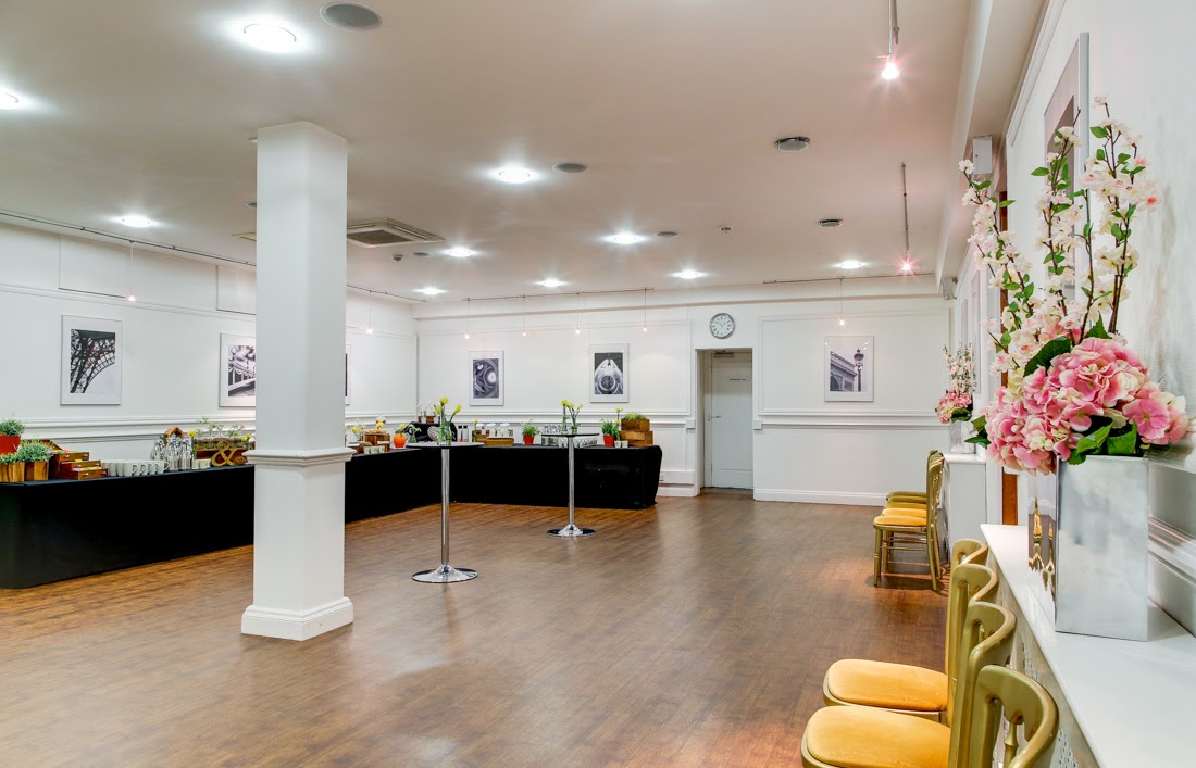 Elegant Marble Hall event space with floral decor for meetings and gatherings.