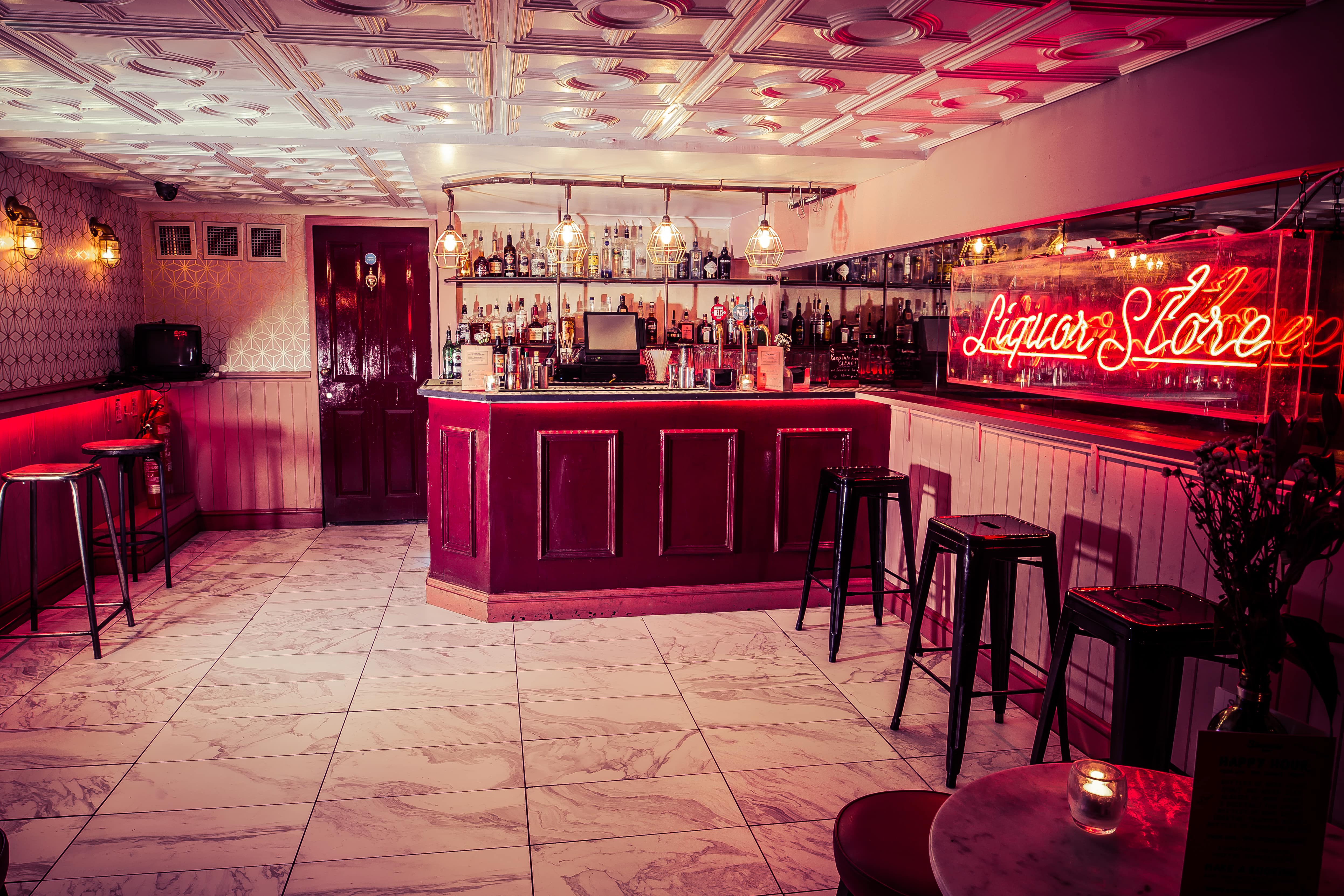 Stylish bar area in Simmons Function Room, ideal for networking events and gatherings.