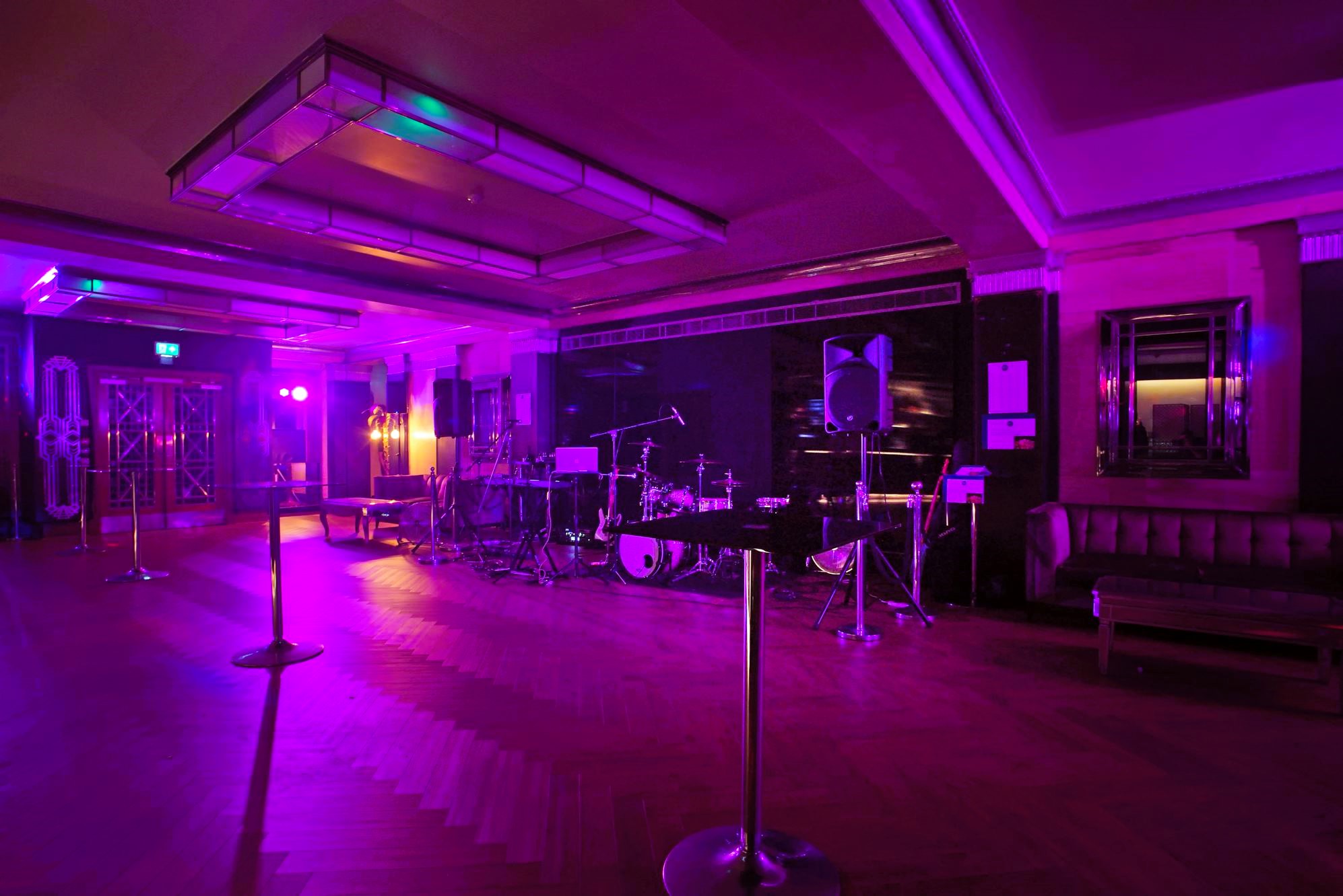 The Rose Bar at The Bloomsbury Ballroom, elegant event space with purple lighting for gatherings.