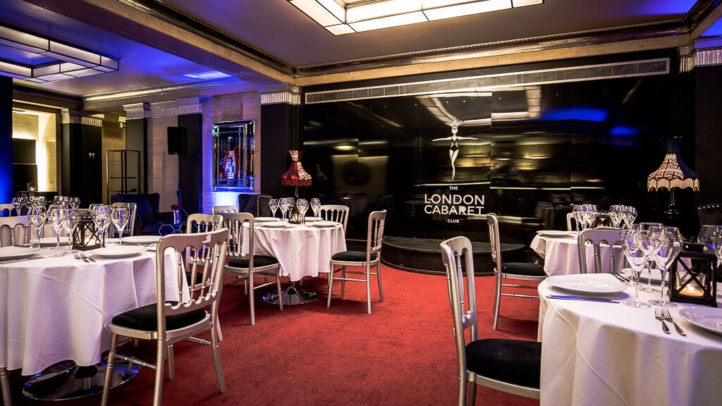 Elegant Rose Bar event space with round tables, ideal for corporate gatherings and parties.