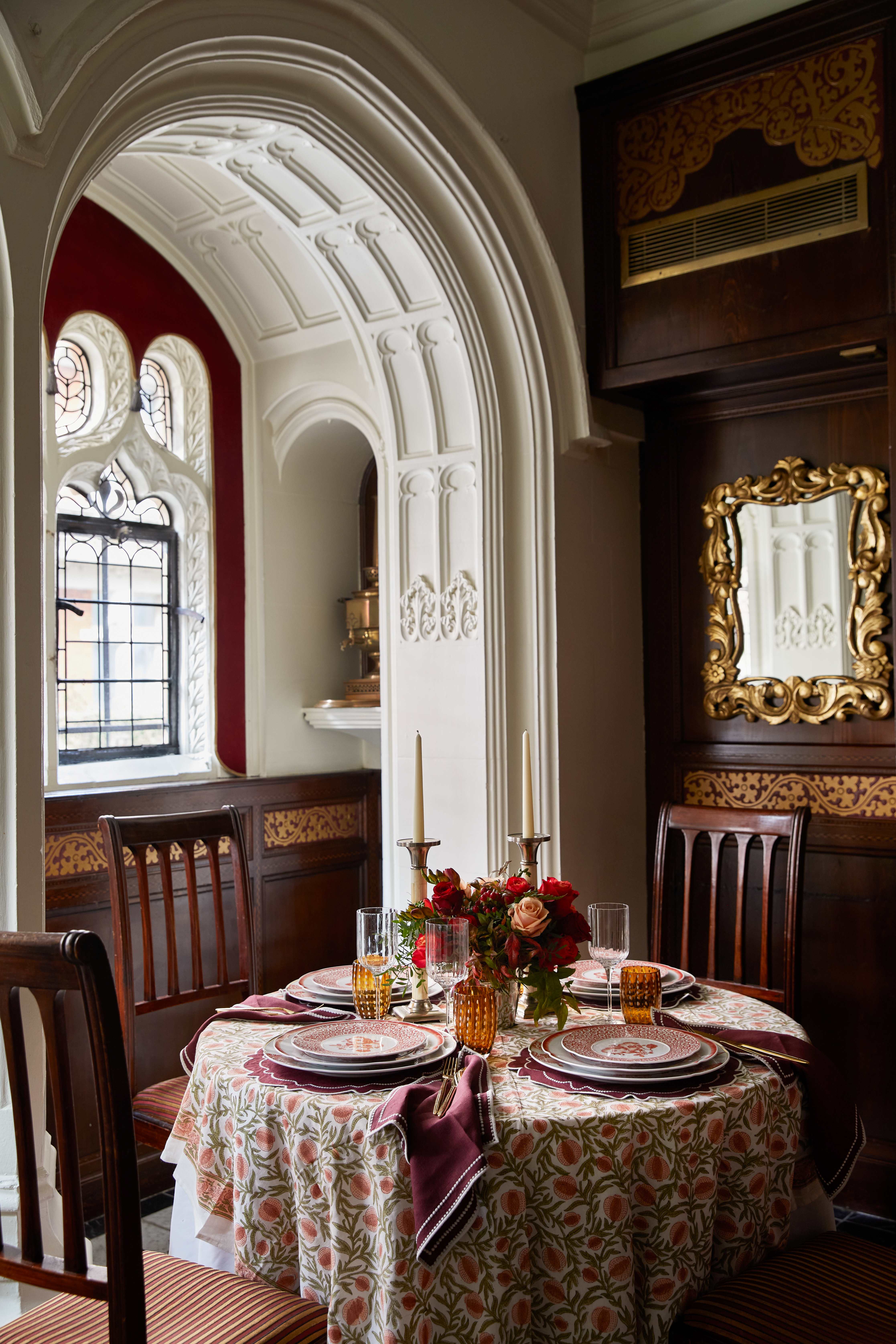 Elegant meeting space at The Oratory, featuring floral centerpieces and warm lighting.