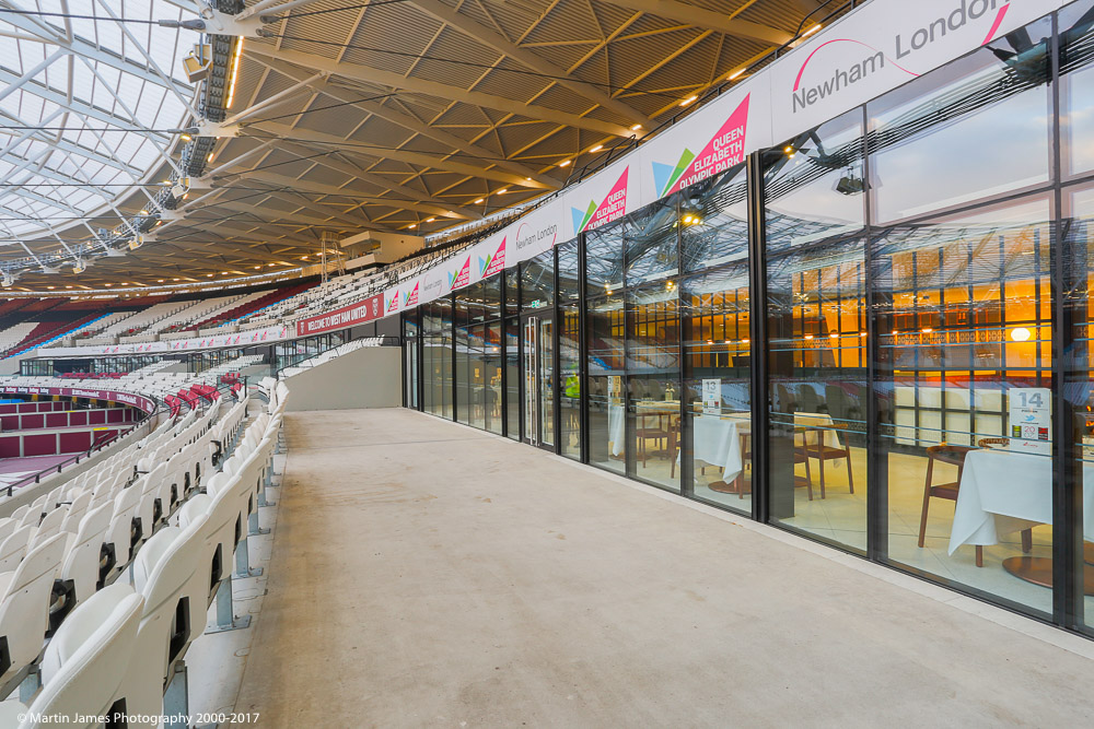 Modern event space in London Stadium with glass walls, ideal for corporate events.