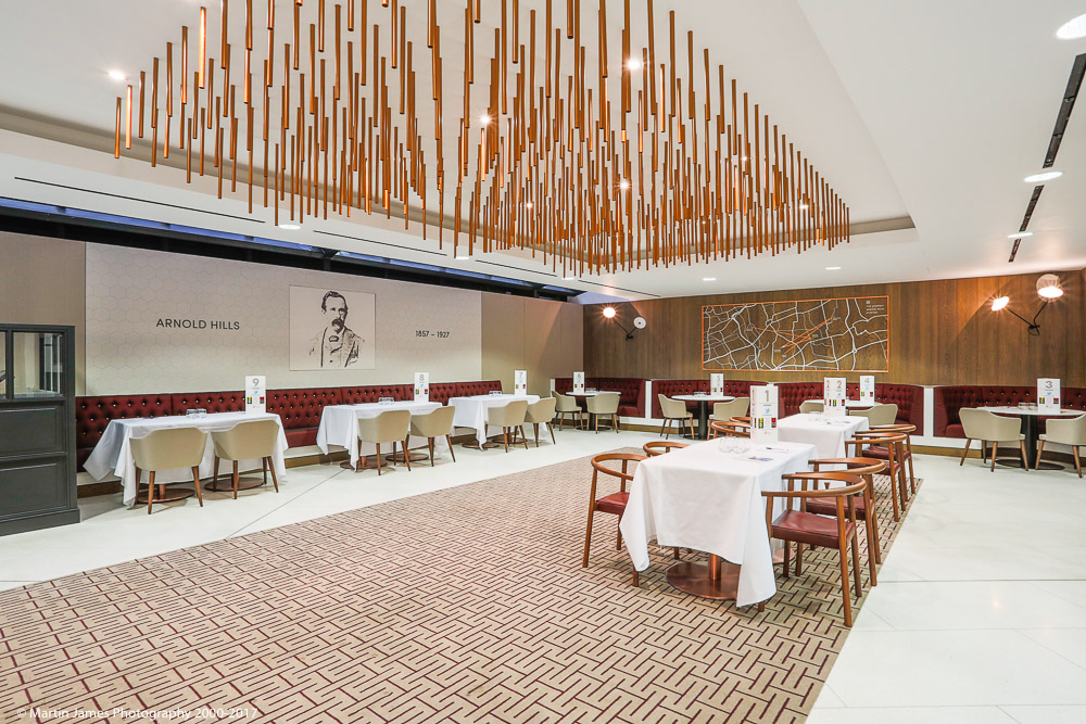 Elegant event space in London Stadium with warm wood accents for upscale gatherings.