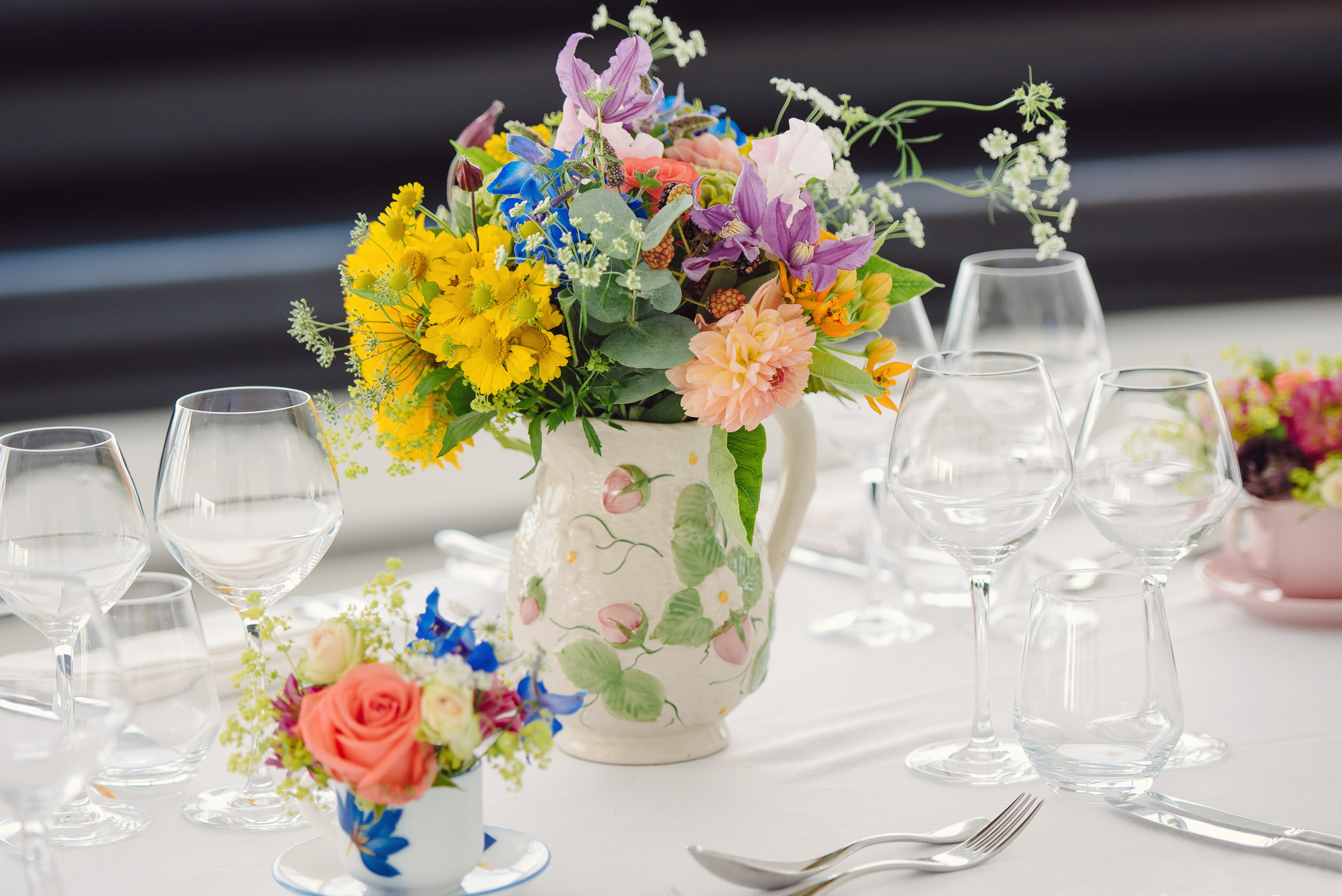 Elegant table setting with floral centerpiece for upscale weddings and events in London.