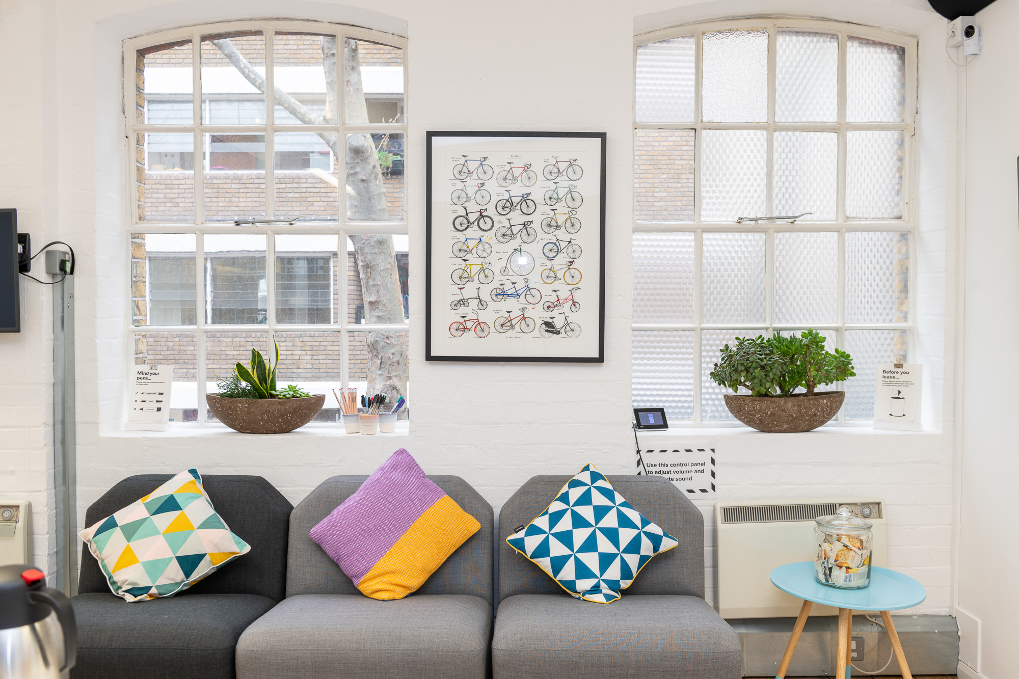 Modern lounge in Sutherland Labs with colorful cushions, ideal for networking events.