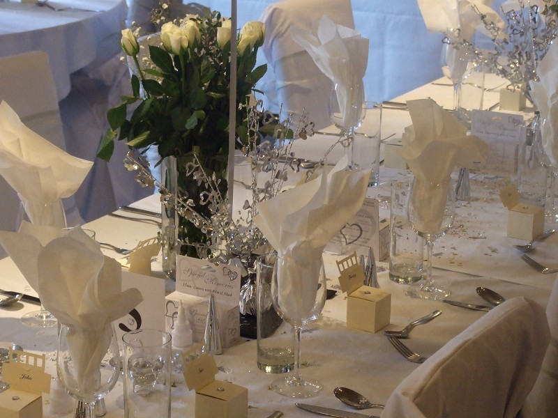 The Windsor Room at The Crown Hotel featuring elegant silver-accented wedding and gala decor.
