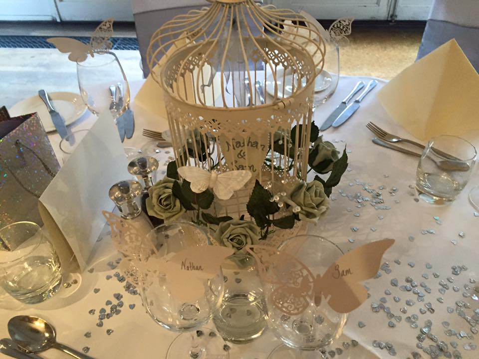 The Windsor Room wedding tablescape with birdcage centerpiece, romantic event decor.