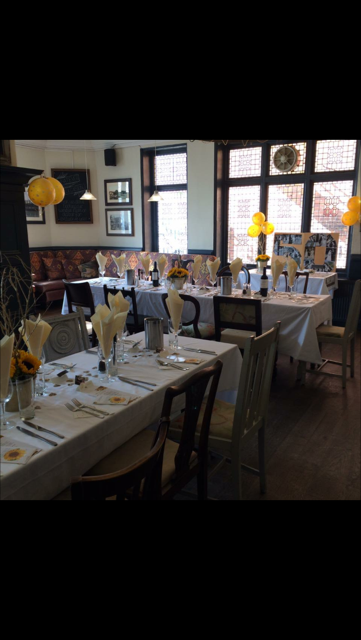 Old Bar at The Crown Hotel: sunflower-themed long-table for milestone birthday party event.