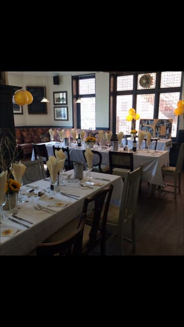 Old Bar at The Crown Hotel: sunflower-themed long-table for milestone birthday party event.