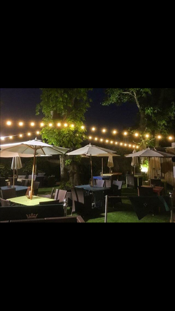 Lounge Garden at The Crown Hotel with string lighting, ideal for networking and corporate events.