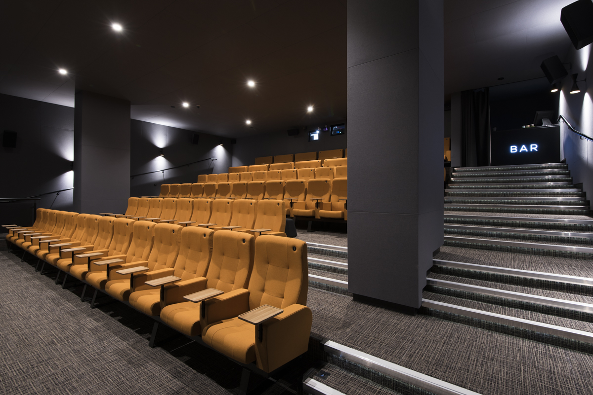 Curzon Aldgate Cinema Screen 2 with vibrant orange tiered seating for events and screenings.
