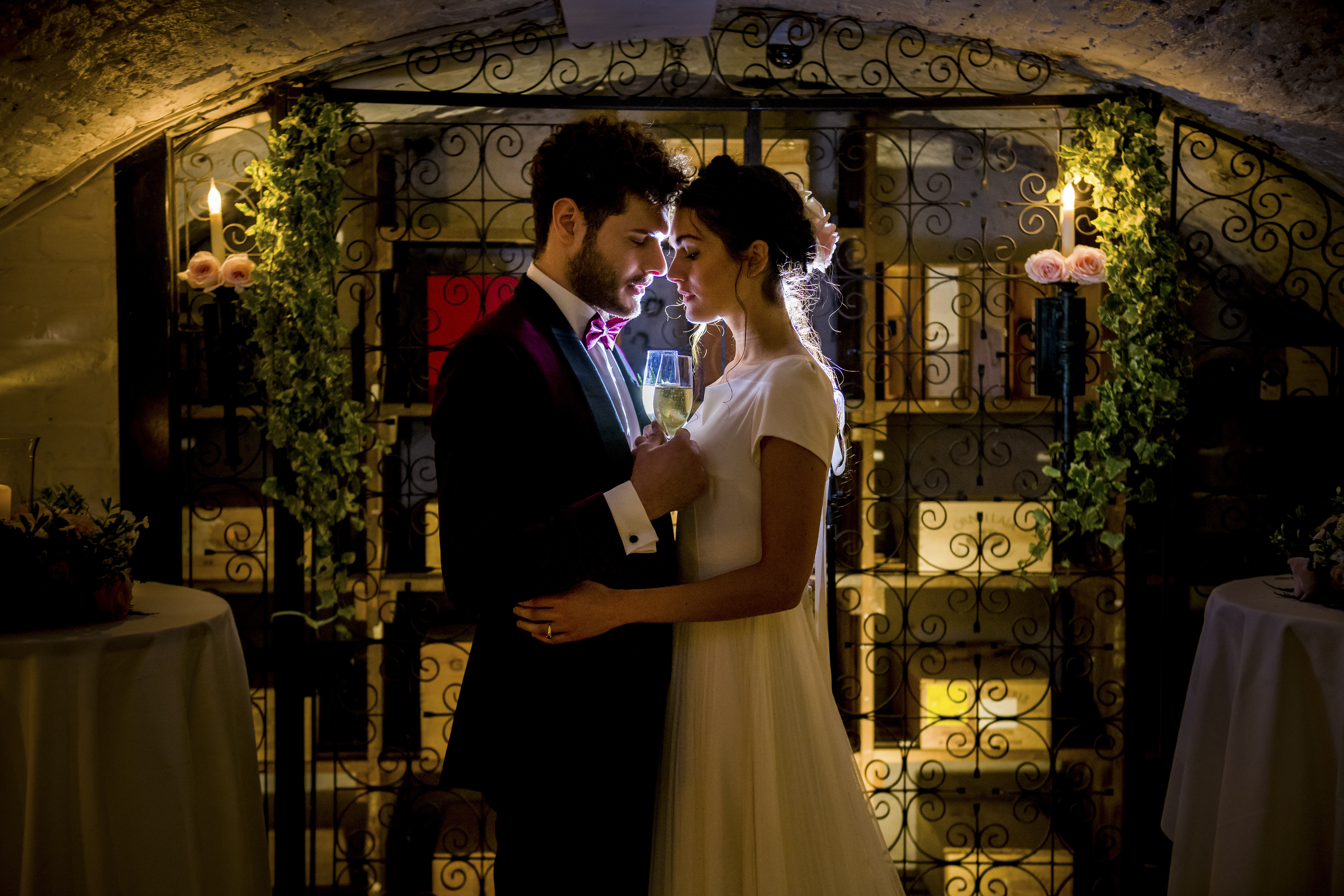 Couple in elegantly lit Wine Cellars, perfect for weddings and romantic events.
