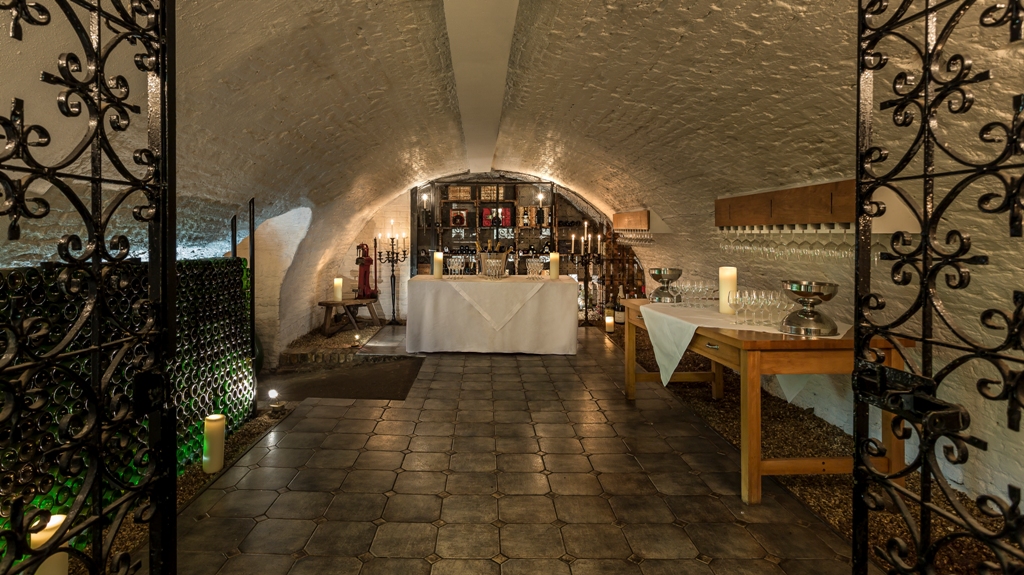 Intimate wine tasting venue with arched ceiling and warm lighting at The Stafford London.
